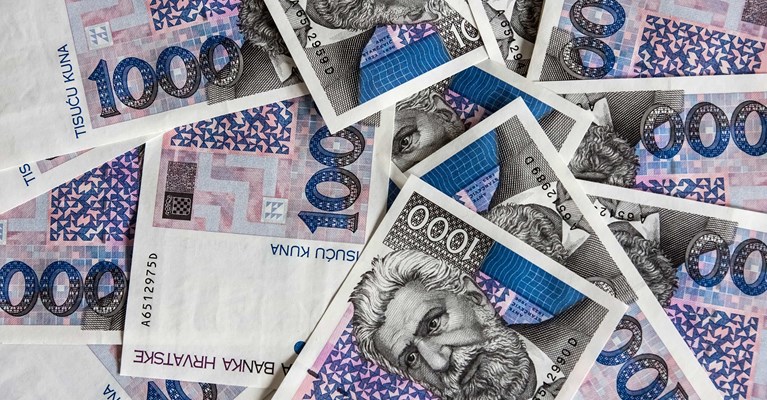Pile of mixed denomination Croation kuna banknotes available at travel money bureaux