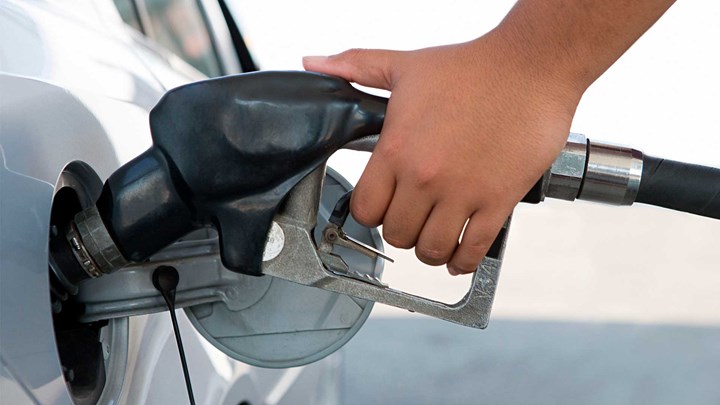 hand using a petrol pump
