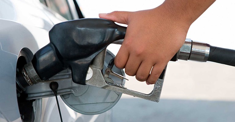 hand using a petrol pump