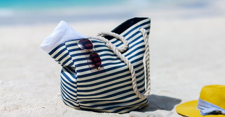 a travel bag on a beach