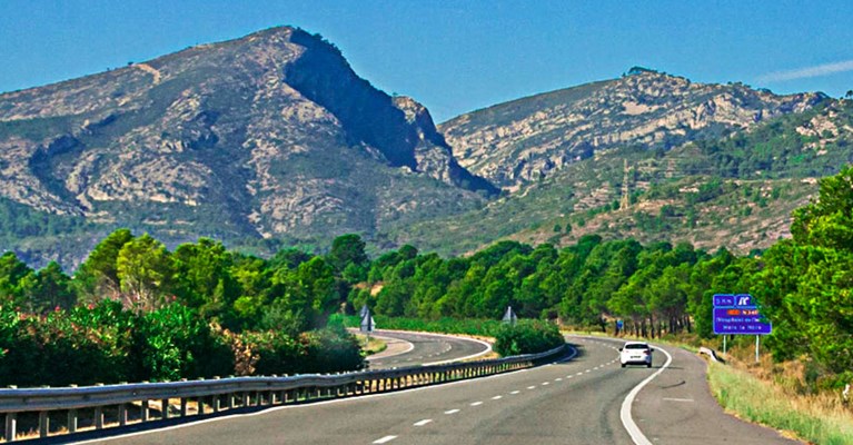 Car driving down a mountain road
