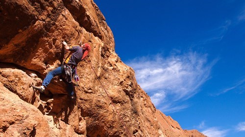 a person lead belay climbing