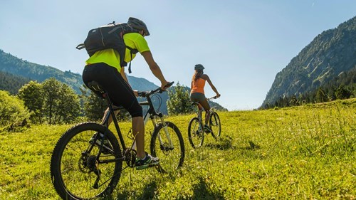 people mountain biking