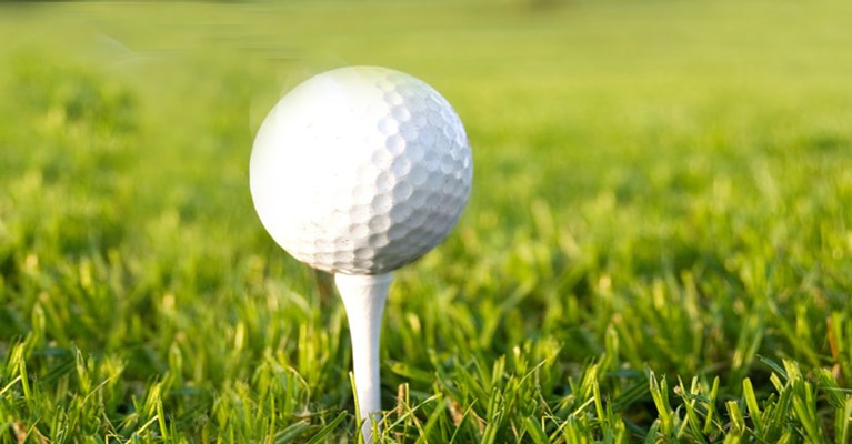 A golf ball on a tee
