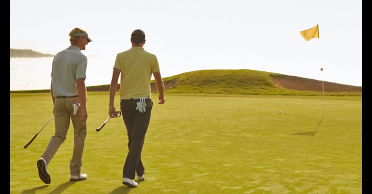 two golfers on a course