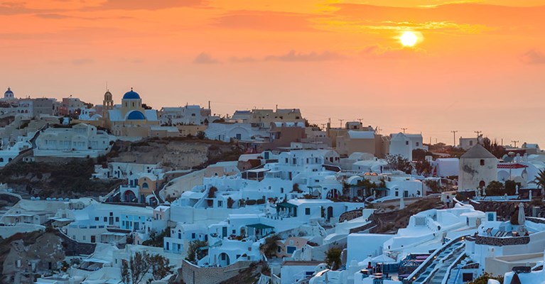 a coastal town at sunset