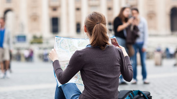 girl reading map