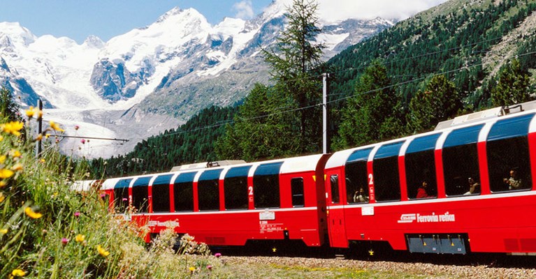 A train by mountains