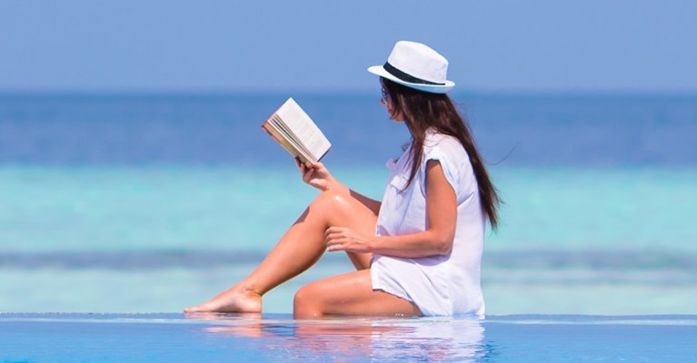 Woman reading on a beach