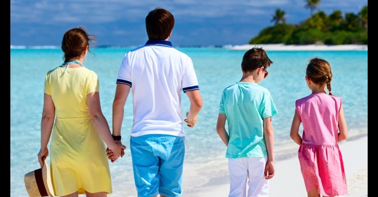 Family walking on a beach