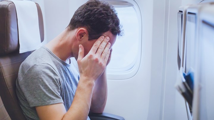 stressed man on aeroplane