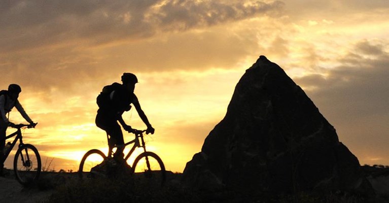 cyclists at sunrise