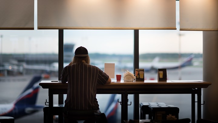 Woman eating at an airport