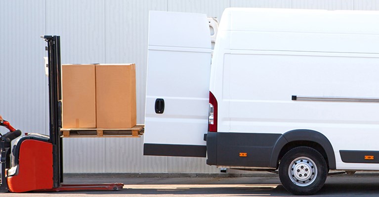 Man loading boxes into a van