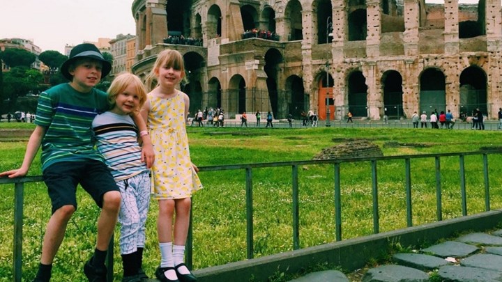 children visiting the coliseum rome