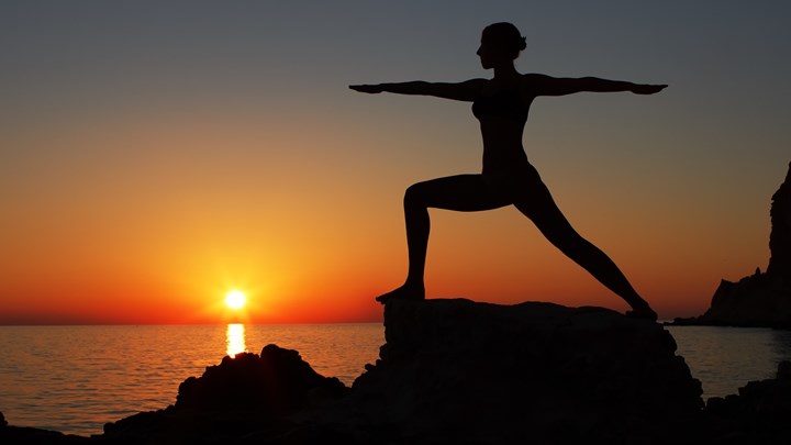 yoga pose at sunset