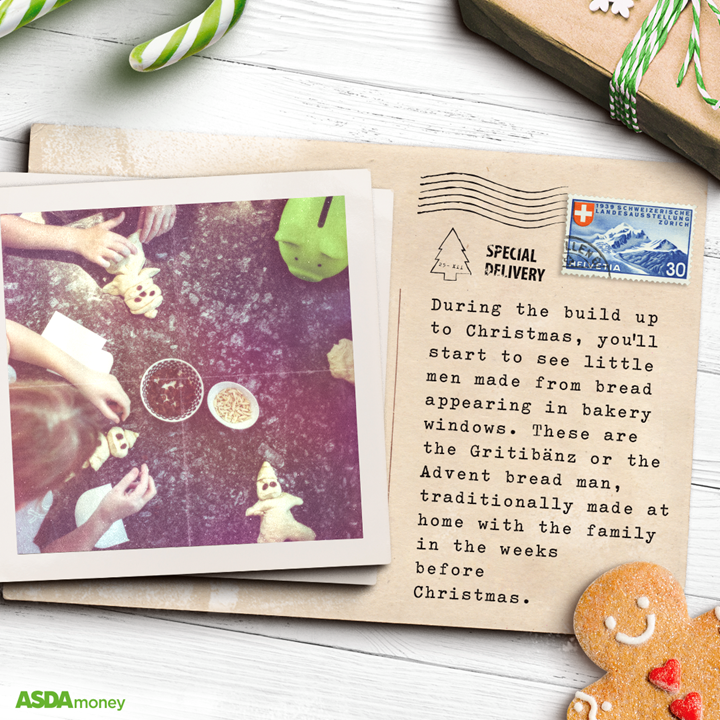 Christmas postcard from Switzerland on table with polaroid and Christmas decorations