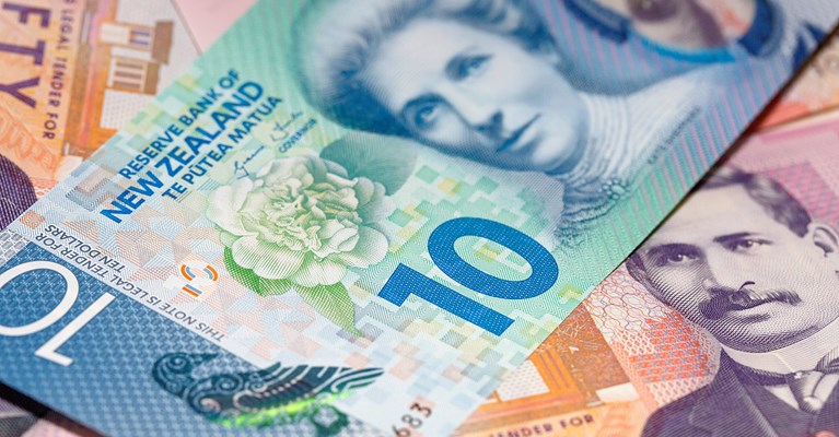 Pile of mixed denomination New Zealand Dollar banknotes