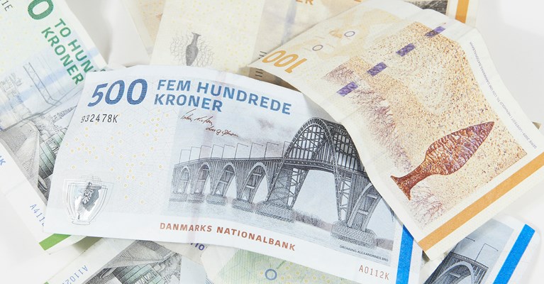 Pile of mixed denomination Danish Krone banknotes