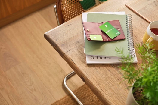 A credit card laid out on a table ready to pay the bill